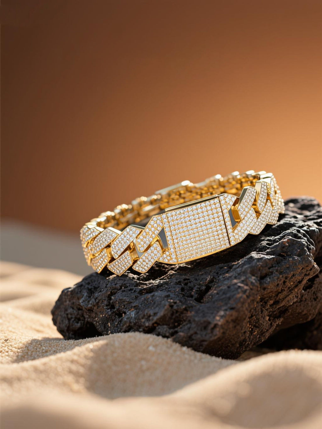 Own Your Bloom 14K gold 20mm diamond Cuban bracelet on textured stone under golden light, luxury jewelry, Los Angeles.