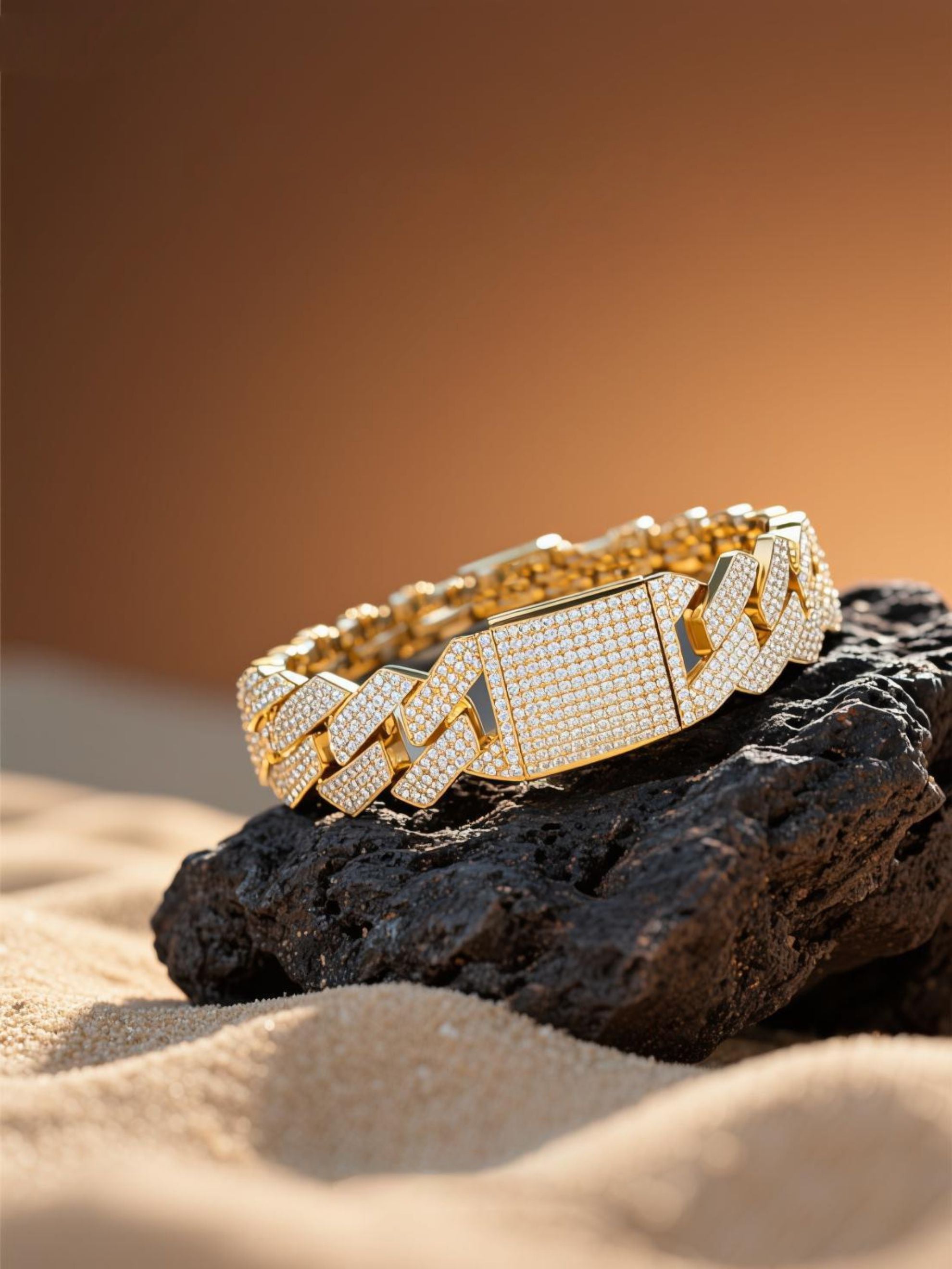 Own Your Bloom 14K gold 20mm diamond Cuban bracelet on textured stone under golden light, luxury jewelry, Los Angeles.