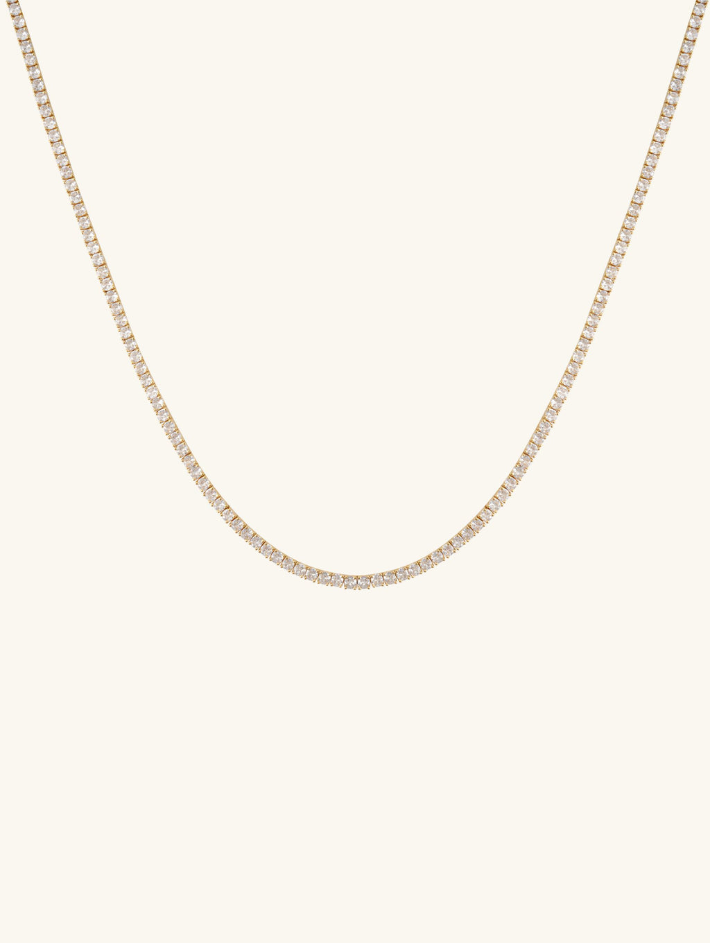 Own Your Bloom 4mm diamond 14K gold tennis chain, classic women’s jewelry product photo on white background, New York.