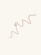 Own Your Bloom Active Pulse Necklace top view showing sparkling diamond-encrusted pendant and bead chain symmetry, Chicago.