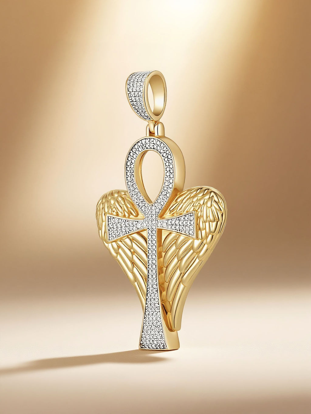 Own Your Bloom winged Ankh cross pendant in warm spotlight lifestyle setup, Miami.