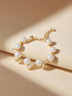 Lifestyle scene of Own Your Bloom Australian white shell pearl 14K diamond bracelet on fabric roll, New York studio light.
