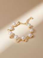 Hero shot of Own Your Bloom Australian white shell pearl bracelet with pavé diamonds, warm light scene, Miami USA.