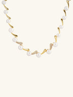 Own Your Bloom Australian white shell pearl 14K gold diamond necklace, front product shot on white background, New York.