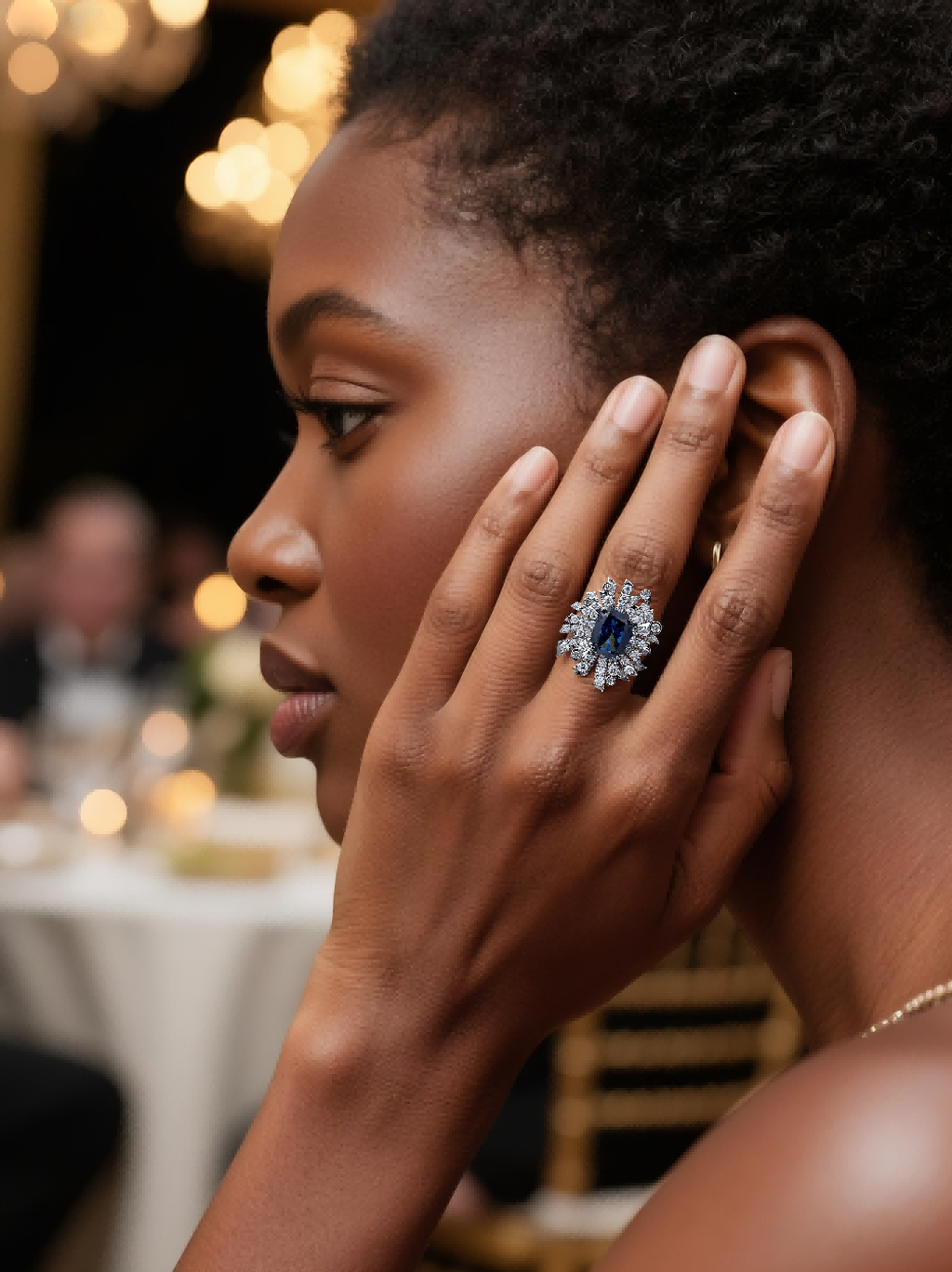 Own Your Bloom Blue Sapphire Floral Ring worn by woman at evening event, showcasing luxury gemstone radiance, New York.