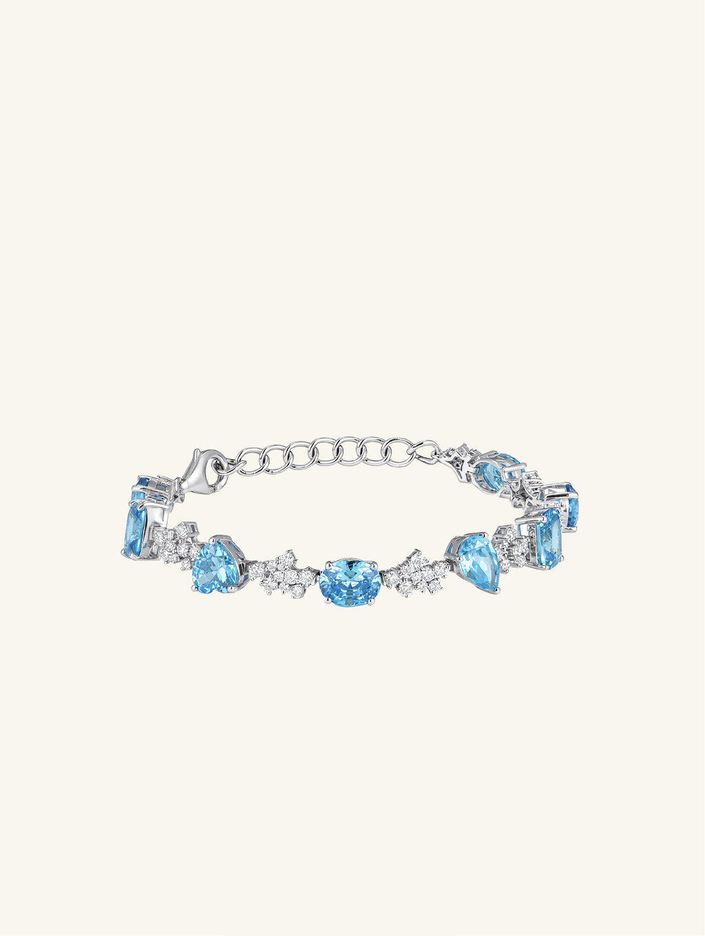 Own Your Bloom blue sapphire tennis bracelet front view featuring oval and baguette-cut stones in white gold, New York.