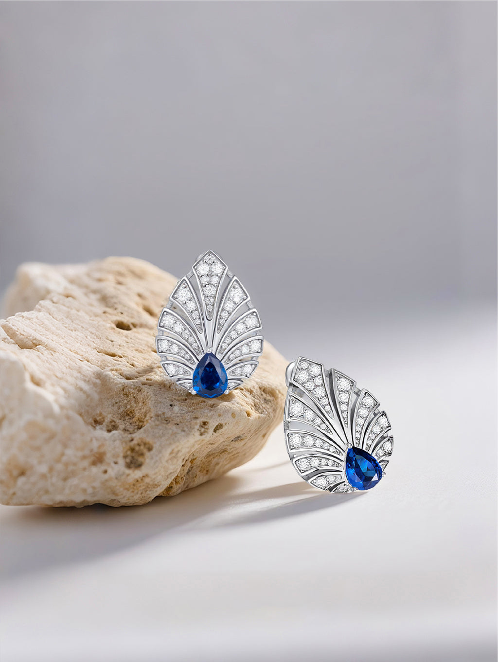 Own Your Bloom Brilliant Gleam sapphire earrings under soft light showing the perfect contrast of diamonds and deep-blue sapphire, Dallas.