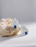Own Your Bloom Brilliant Gleam sapphire earrings under soft light showing the perfect contrast of diamonds and deep-blue sapphire, Dallas.