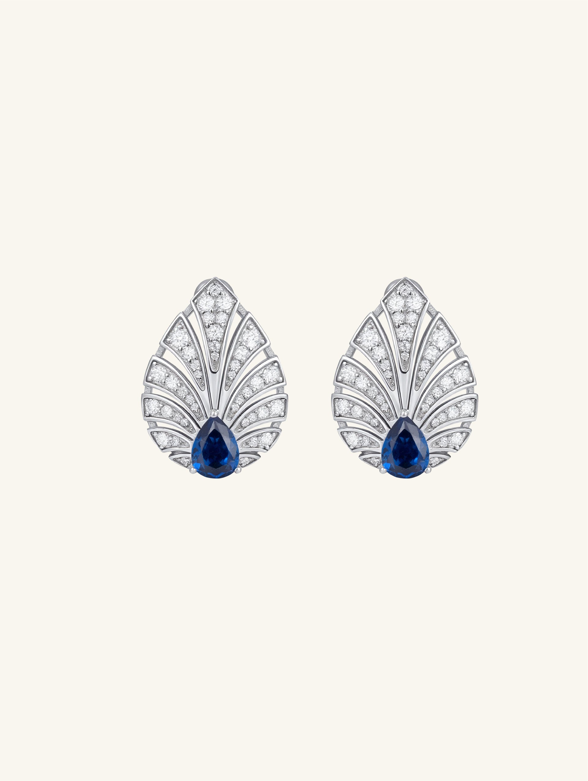 Own Your Bloom Brilliant Gleam sapphire earrings front view with teardrop blue sapphire and diamond fan pattern, elegant fine jewelry, New York.