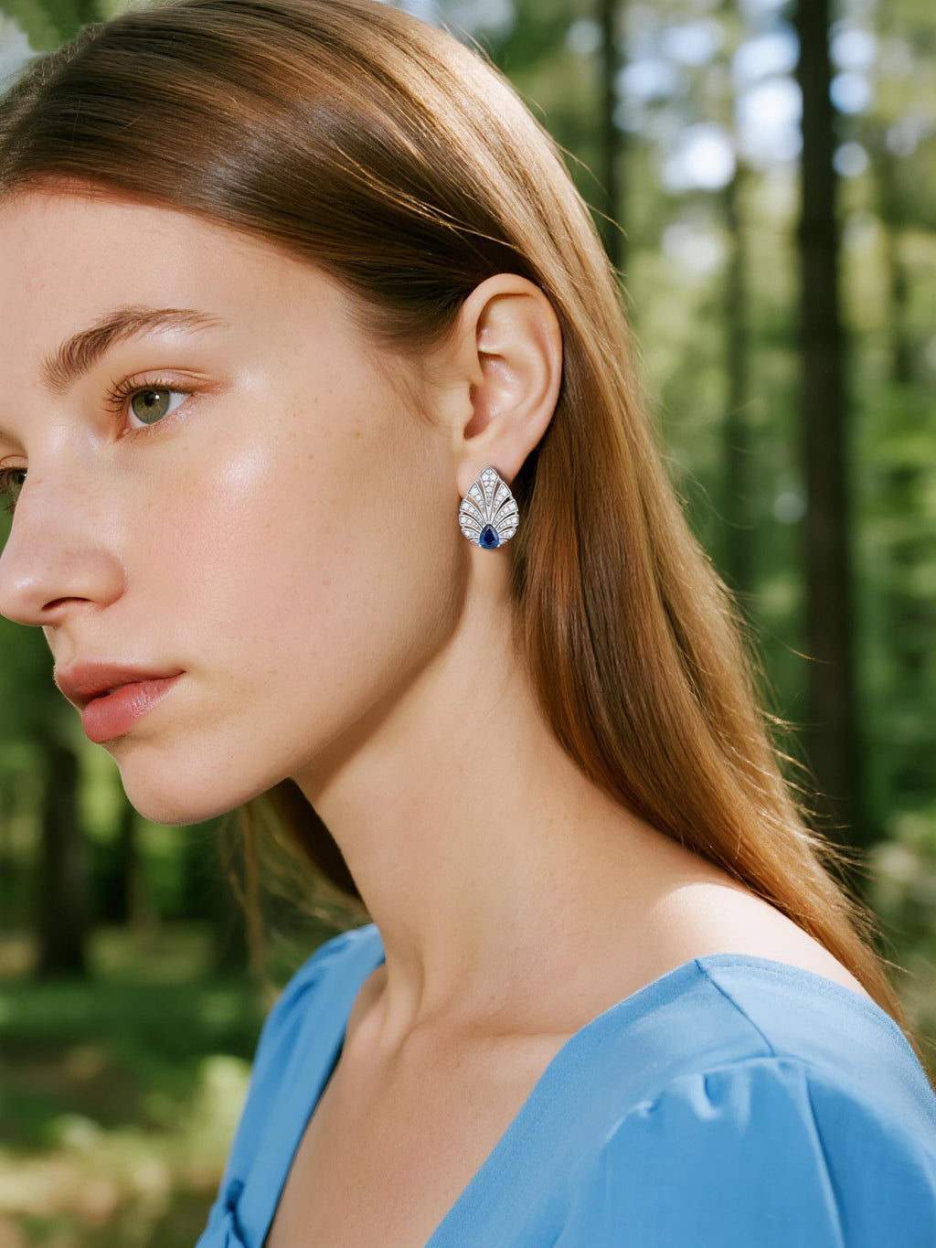 Own Your Bloom Brilliant Gleam sapphire diamond earrings on woman’s ear, luxurious fine jewelry radiating sophistication, Los Angeles.