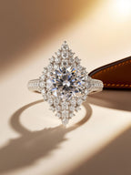 Studio hero of Own Your Bloom cluster halo statement ring with round center and pavé halo.