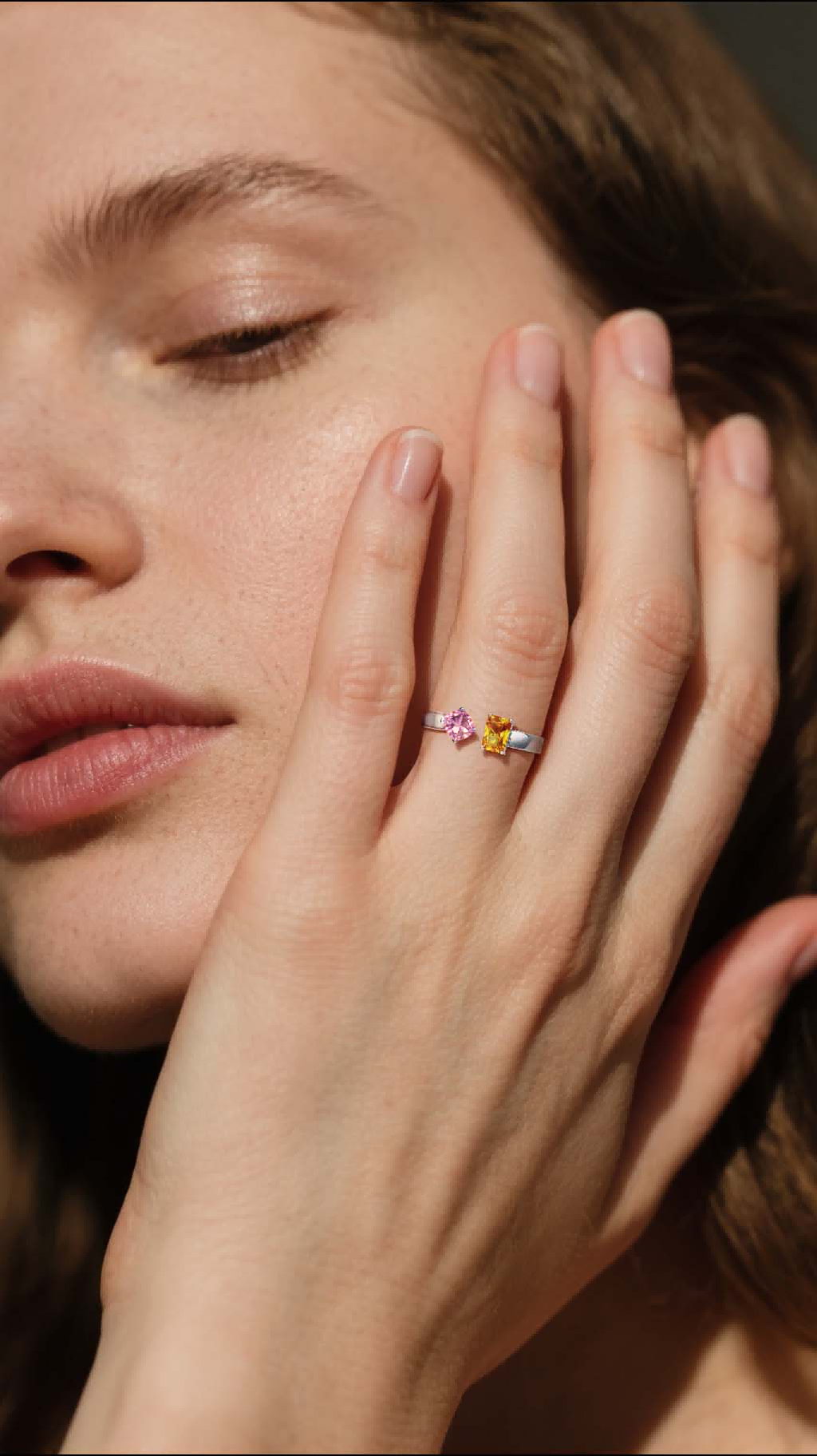 Own Your Bloom Colorful Gemstone Ring worn by woman in sunlight, amethyst and citrine sparkle with elegance, New York.