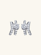 Own Your Bloom Crystal Ribbon Stud Earrings front view showing intertwined ribbon design with sparkling round-cut crystals, New York.