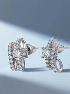 Own Your Bloom Crystal Ribbon Stud Earrings displayed under soft blue light, embodying elegance and modern rhythm, Miami.