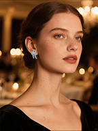 Own Your Bloom Silver Ribbon Earrings on woman at café, showing timeless urban elegance and soft sparkle, Los Angeles.