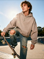 Flat lay of Own Your Bloom 14K gold diamond cross pendant with sparkle accents, San Francisco.