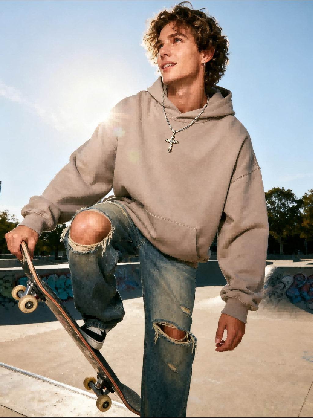 Flat lay of Own Your Bloom 14K gold diamond cross pendant with sparkle accents, San Francisco.