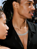 Own Your Bloom 14K gold diamond Cuban chain worn by man at nightlife event, high-end luxury accessory, Los Angeles.