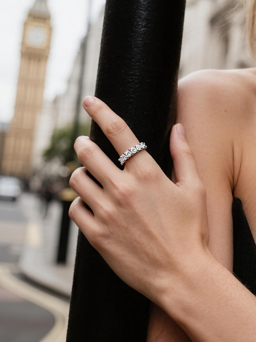 Own Your Bloom Full Eternity Diamond Ring worn by woman in city street scene, expressing confidence and elegance, New York.