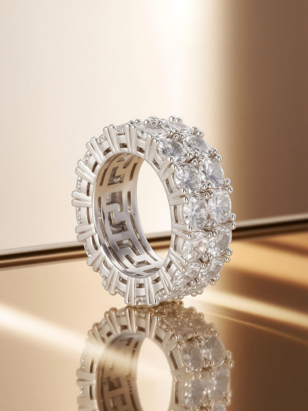 Studio hero of Own Your Bloom double-row round eternity ring highlighting reflective prong setting.
