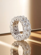 Studio hero of Own Your Bloom double-row round eternity ring highlighting reflective prong setting.
