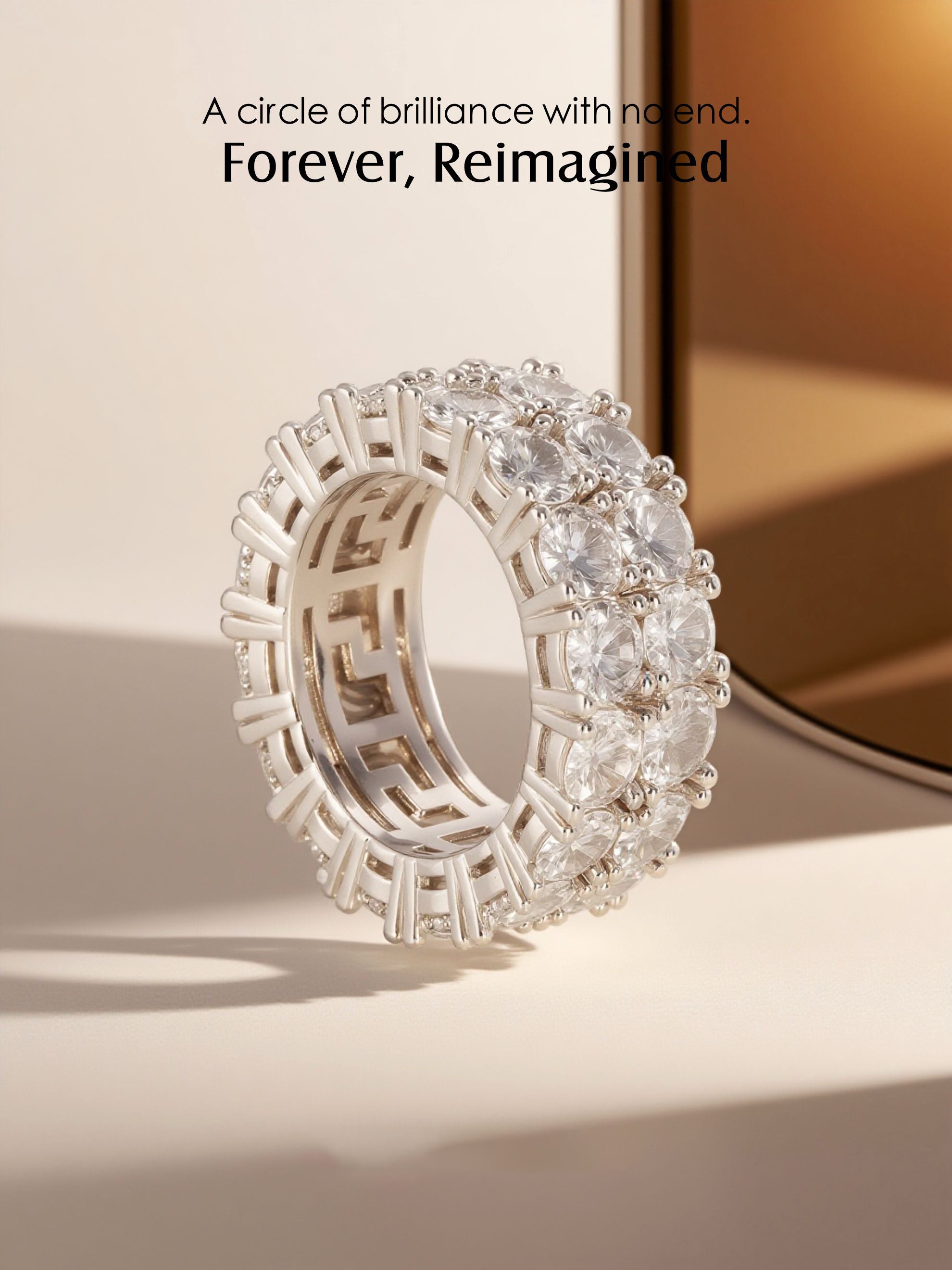 Reflective studio shot of the Own Your Bloom white-gold-plated double-row eternity band.