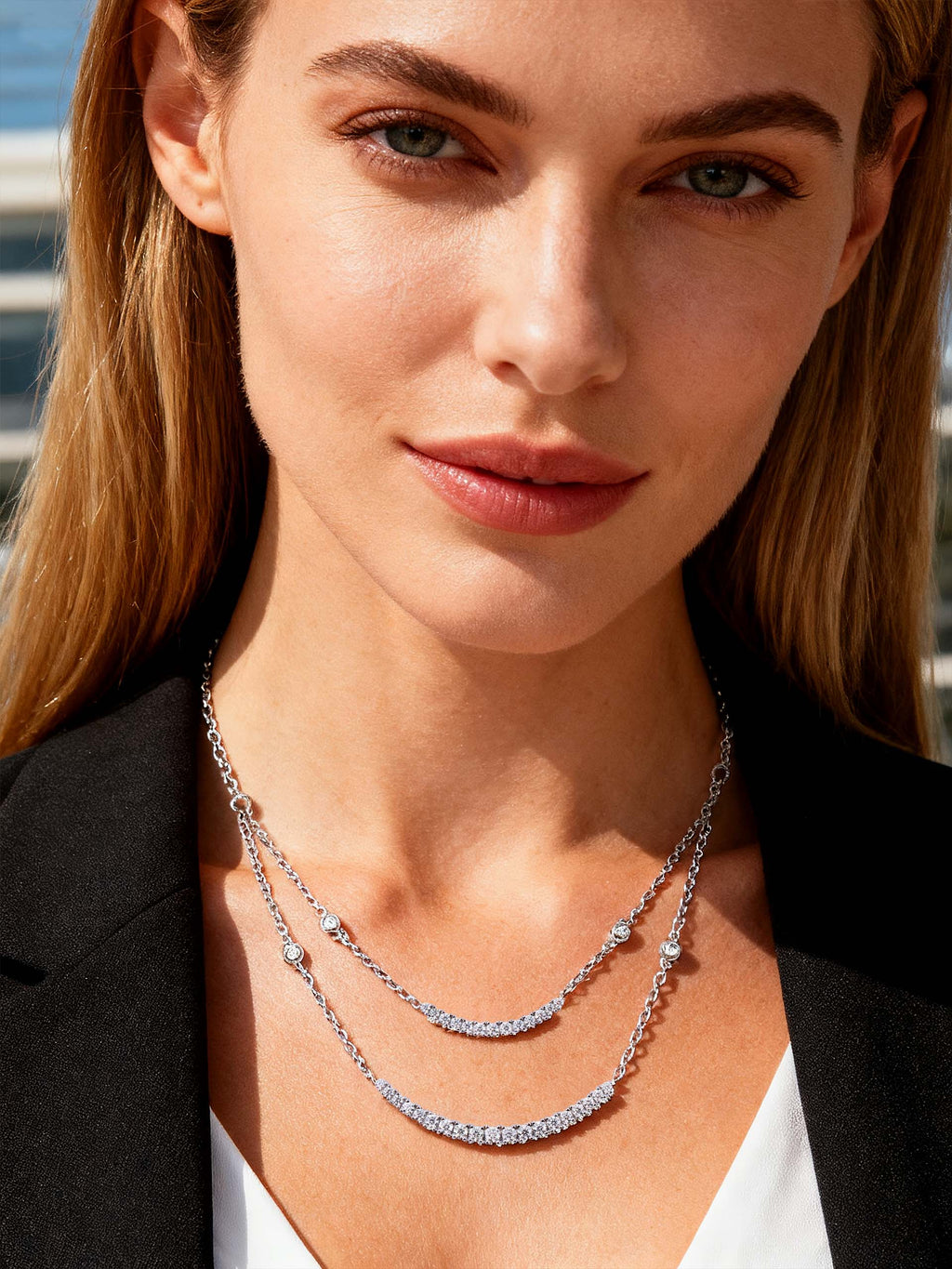 Own Your Bloom Double Strand Crystal Necklace worn by woman under sunlight, highlighting modern grace and brilliance, Miami.