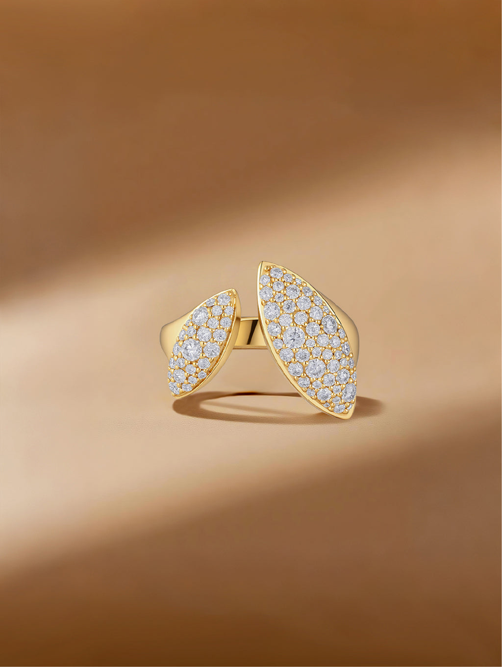 Own Your Bloom Dual Flame moissanite ring displayed on warm golden surface, symbolizing elegance and empowerment, Miami.