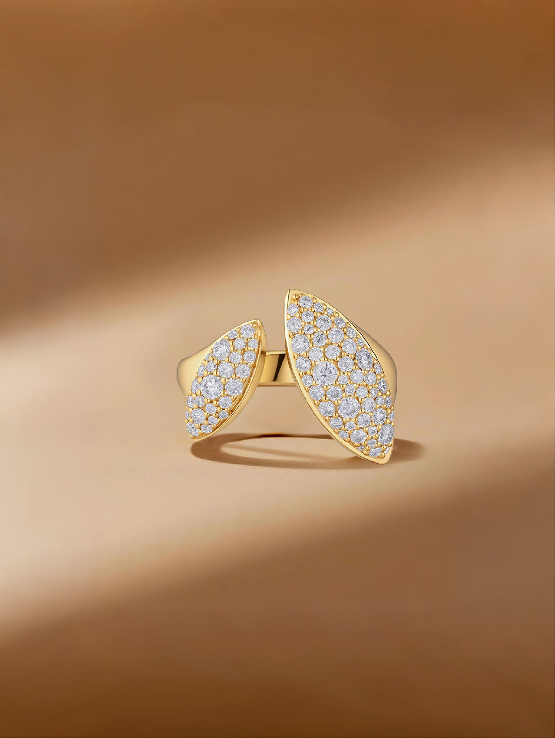 Own Your Bloom Dual Flame moissanite ring displayed on warm golden surface, symbolizing elegance and empowerment, Miami.