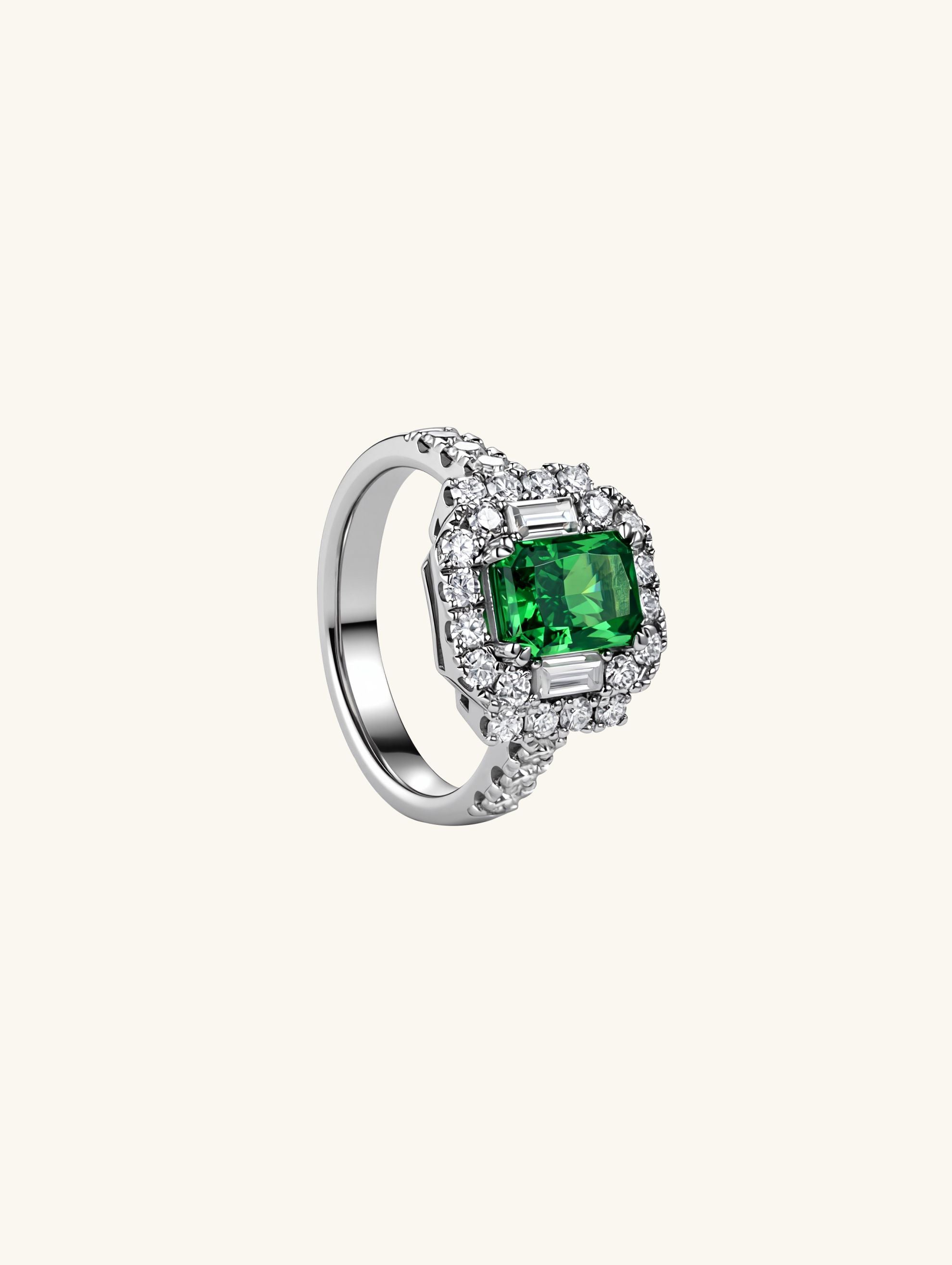 Own Your Bloom green emerald diamond halo ring side angle showing baguette and round cut brilliance, luxury gemstone ring, Los Angeles.