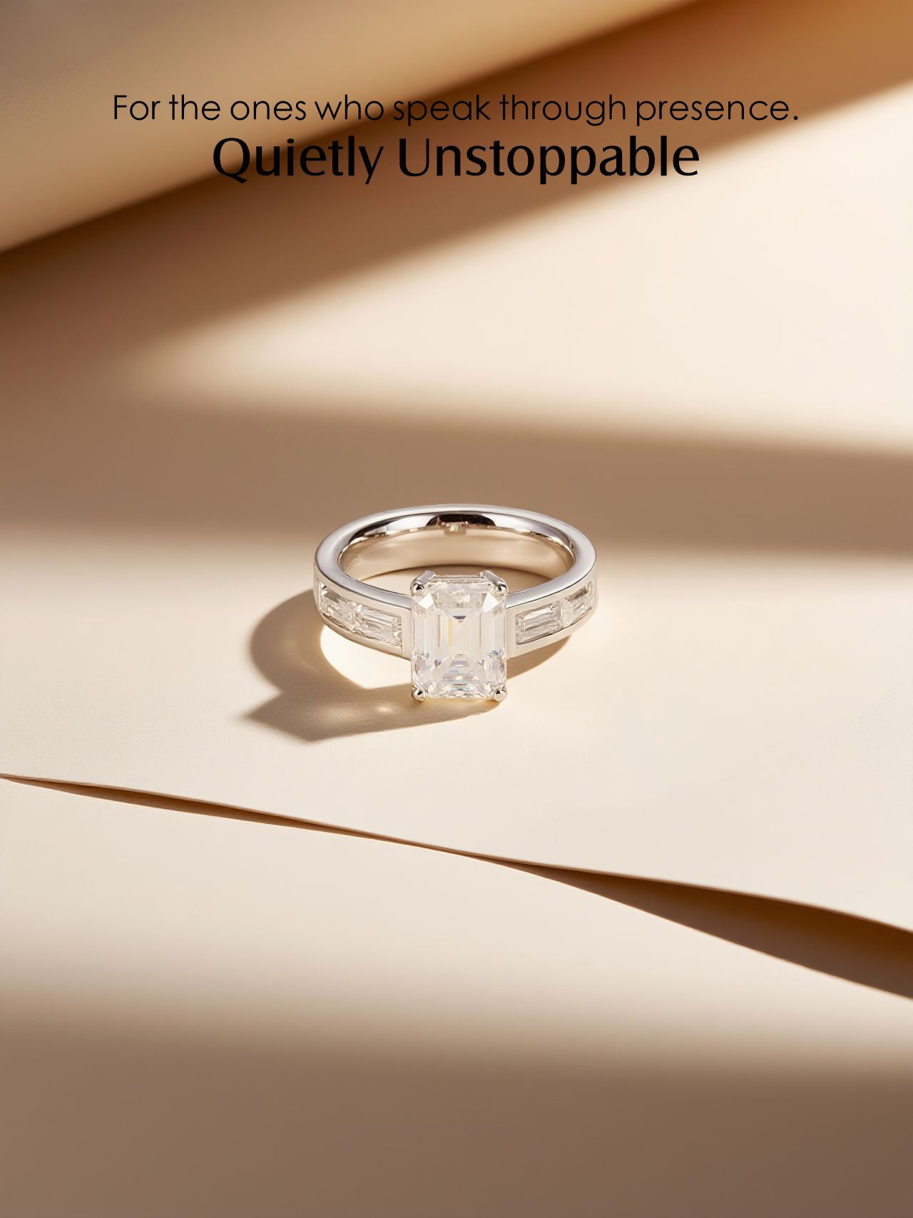 Own Your Bloom emerald-cut diamond engagement ring, lifestyle scene with soft studio light and shadows, Los Angeles.