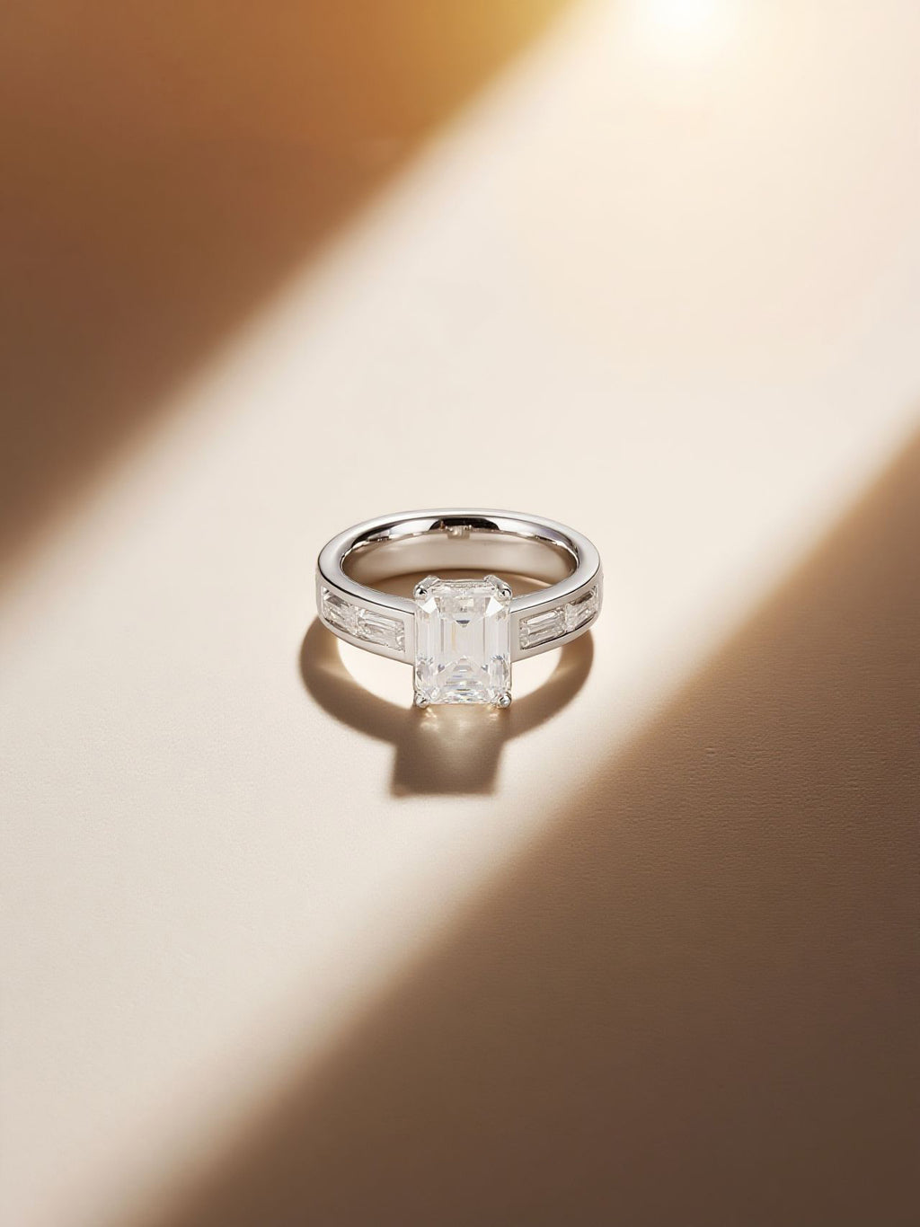Own Your Bloom emerald-cut diamond engagement ring, lifestyle scene with sculptural backdrop, San Francisco.