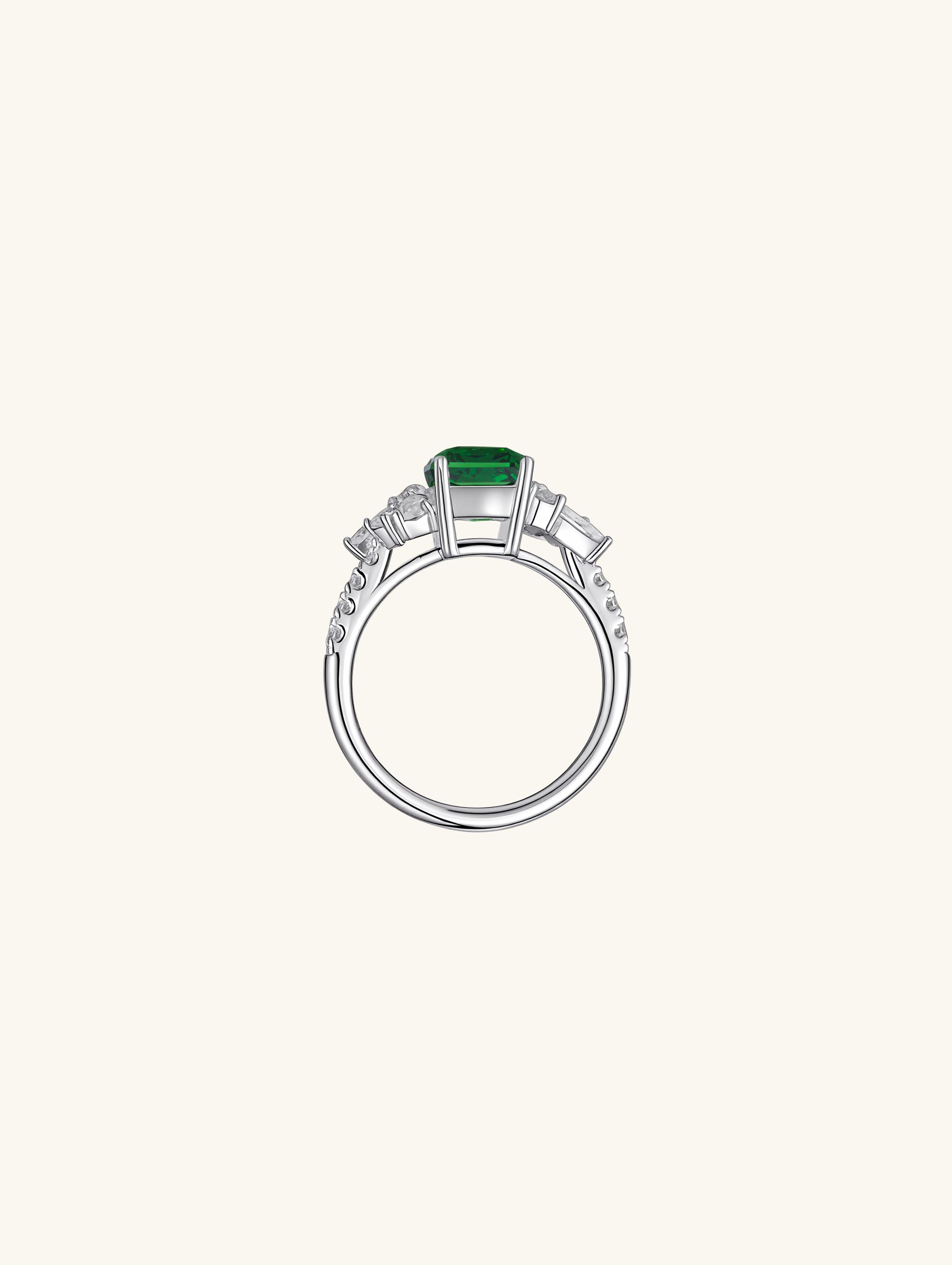 Own Your Bloom emerald cut green gemstone ring detailed view showcasing brilliance and fine craftsmanship, Chicago.