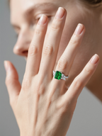Own Your Bloom emerald green cluster ring worn by woman holding coffee cup, elegant fine jewelry style, New York.