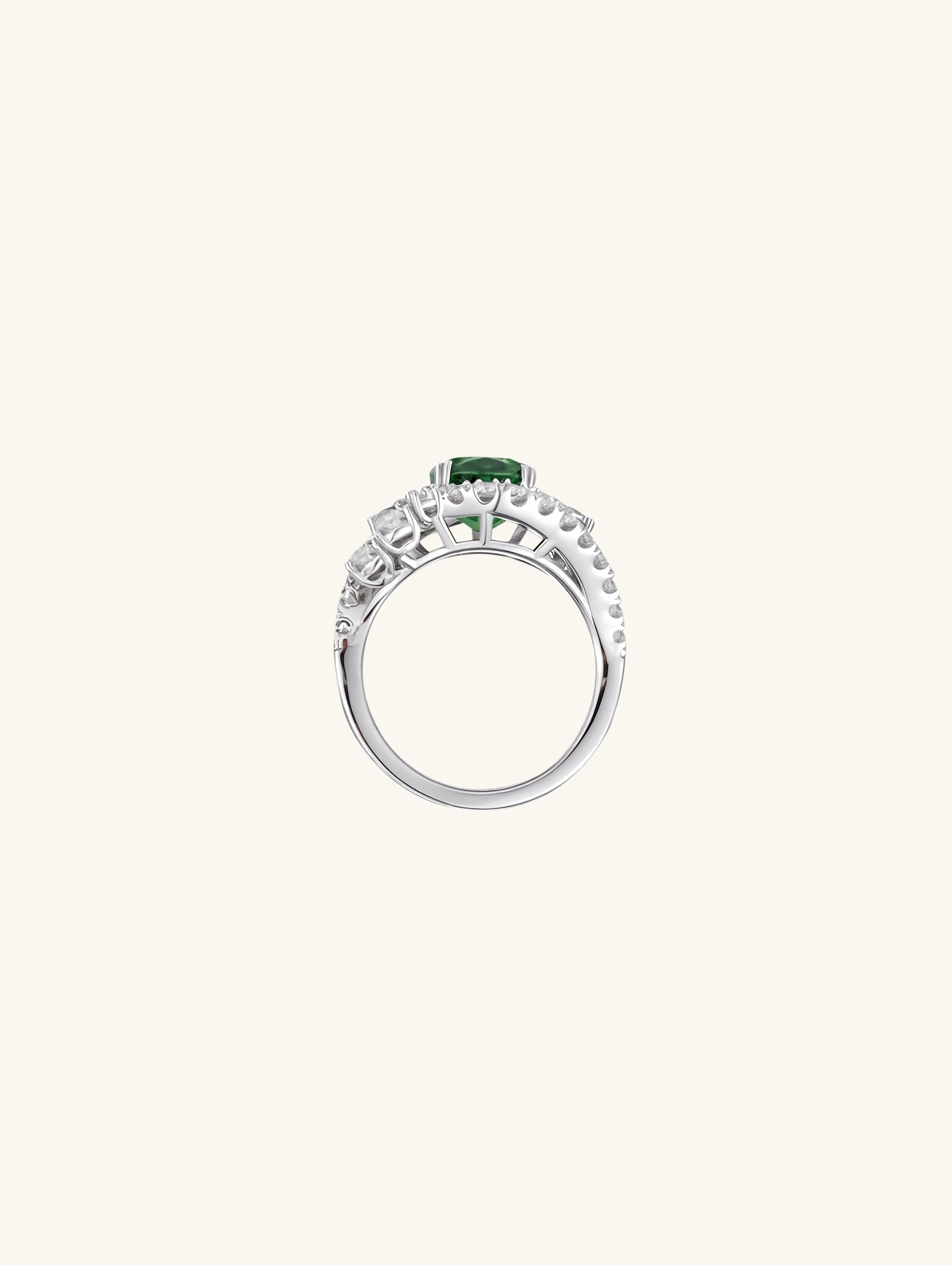 Own Your Bloom emerald oval halo ring with sparkling diamond accents and elegant white gold setting, Chicago.
