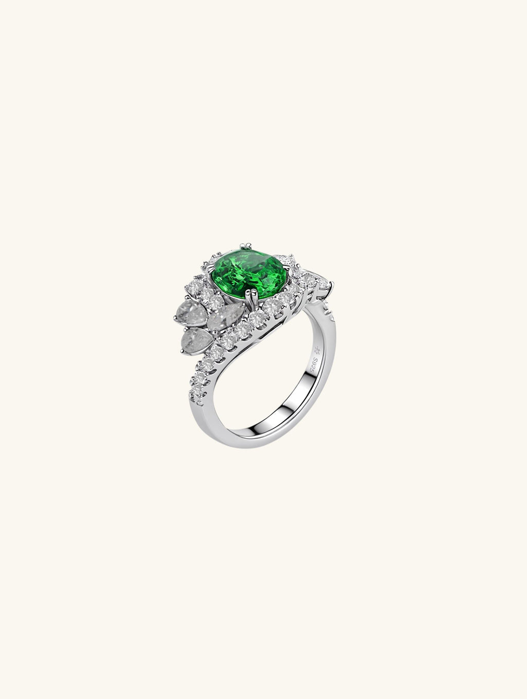 Own Your Bloom emerald oval halo diamond ring side view highlighting brilliant craftsmanship and silver band, Los Angeles.