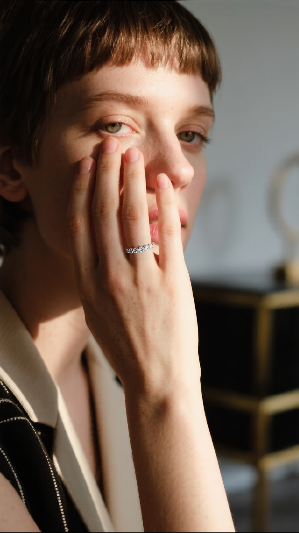 Own Your Bloom diamond eternity ring on woman’s hand, minimal yet radiant jewelry styling, New York.