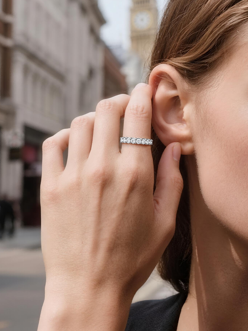 Own Your Bloom Full Eternity Diamond Band Ring worn by woman in chic outfit, showcasing refined grace and brilliance, Miami.