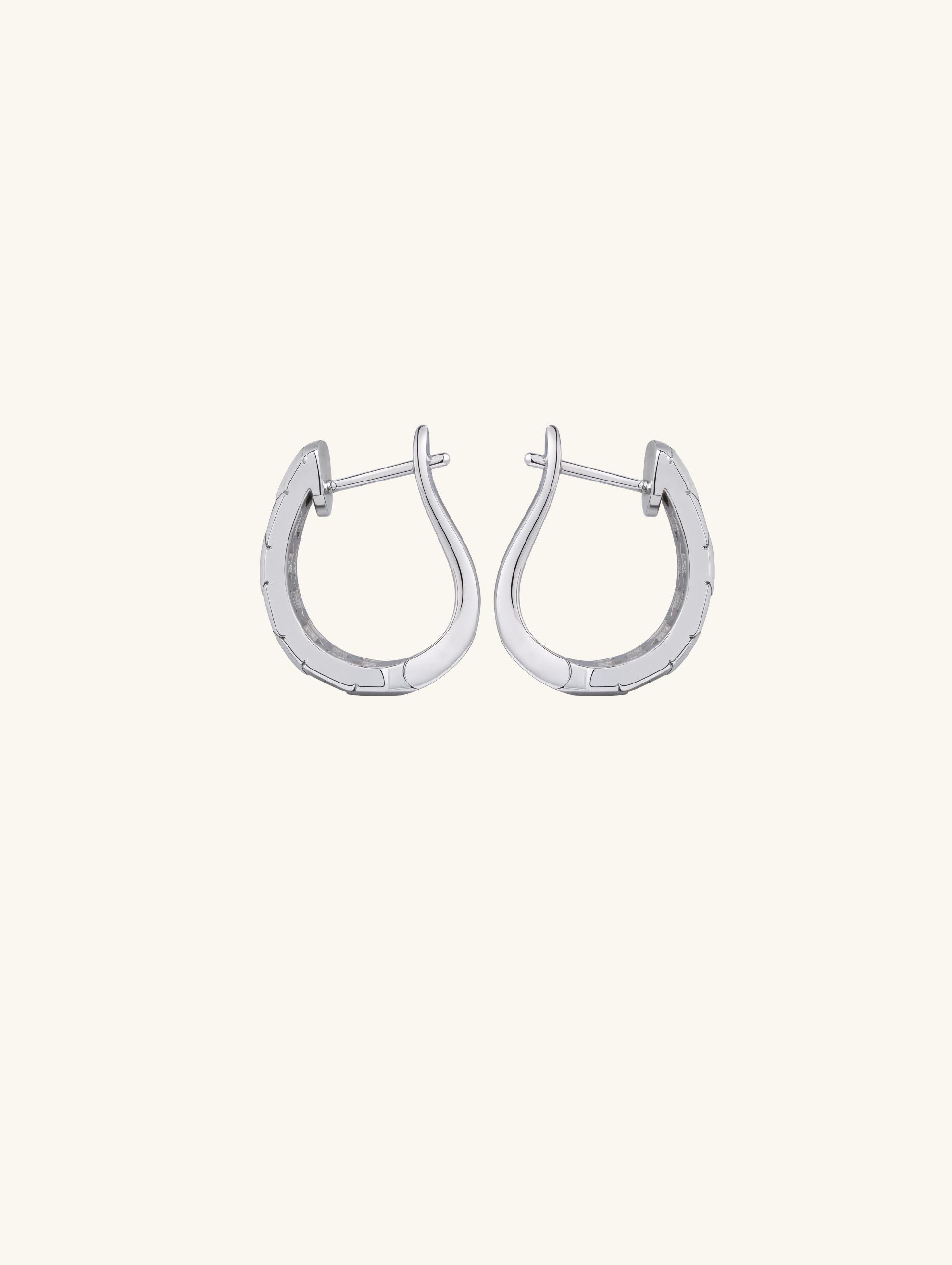 Own Your Bloom hexagon silver hoop diamond earrings close-up showing craftsmanship and contemporary elegance, Chicago.