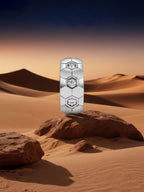 Own Your Bloom hexagon silver diamond earrings displayed against desert landscape background, symbolizing strength and brilliance, Miami.