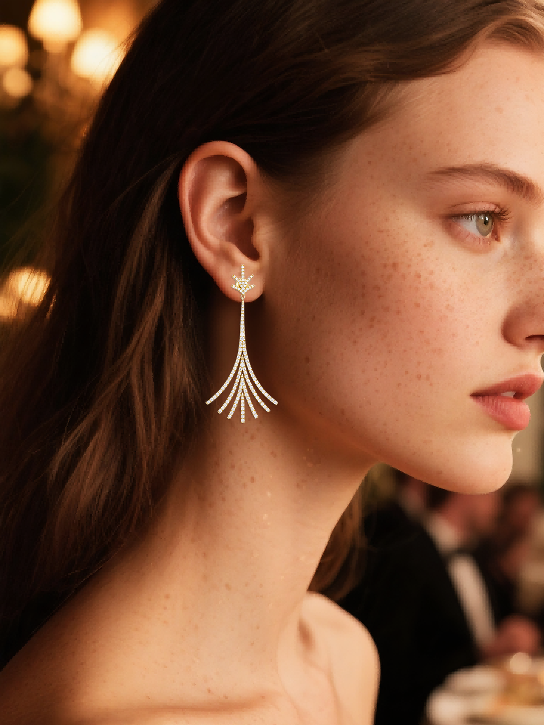 Own Your Bloom Twilight Bloom gold long drop earrings worn by woman at evening event, timeless sparkle and grace, New York.