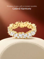 Own Your Bloom gold eternity band ring with marquise and round moissanite stones in radiant warm studio setting, Boston.