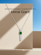 Own Your Bloom green gemstone tassel necklace in soft daylight highlighting diamond flow and vivid green centerpiece, Boston.