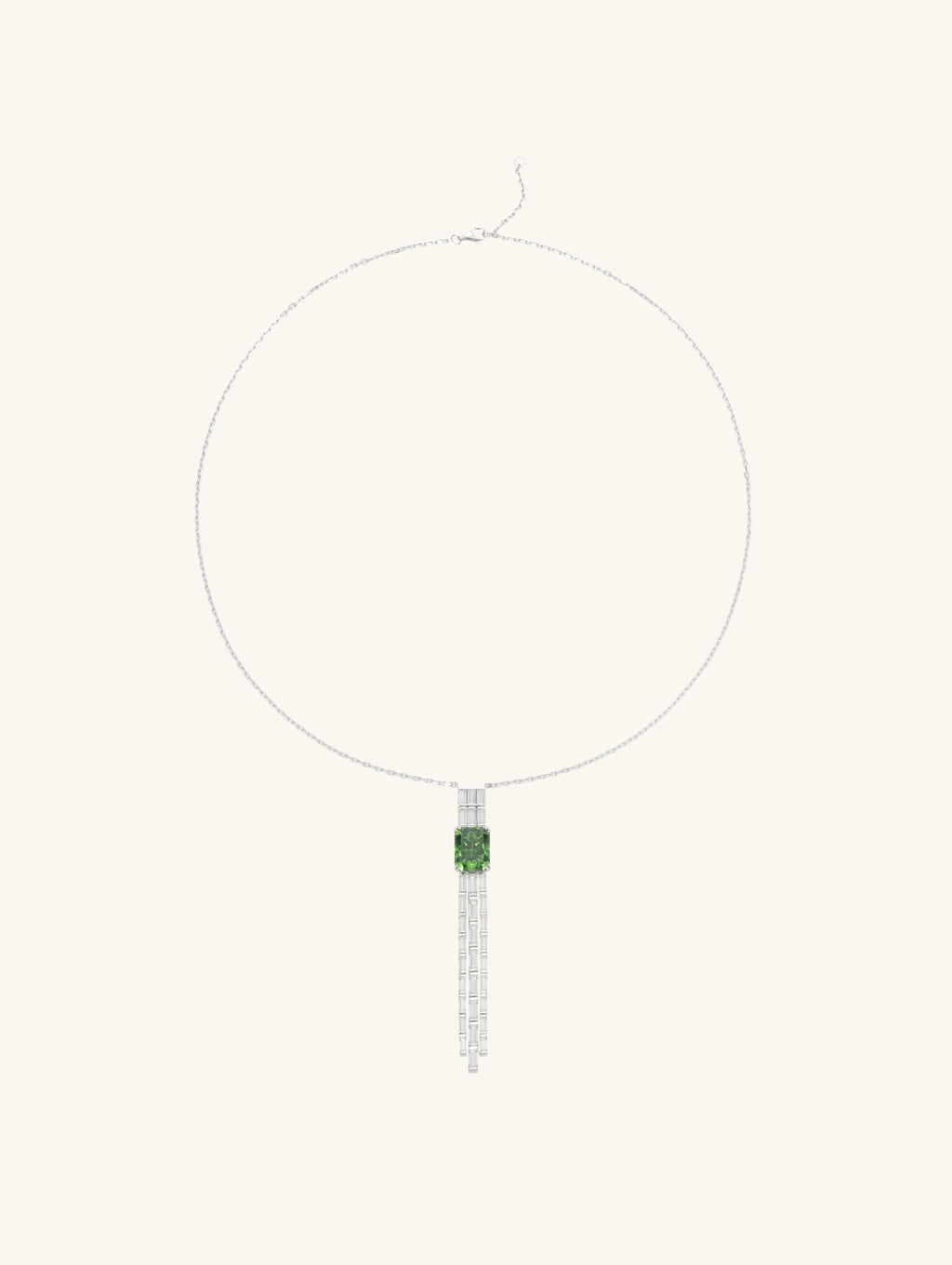 Own Your Bloom green gemstone tassel necklace side view highlighting baguette-cut diamond strands and radiant green gem centerpiece, Los Angeles.