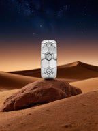 Own Your Bloom hexagon-pattern silver diamond earrings on artistic desert scene, elegant minimalist fine jewelry, Boston.