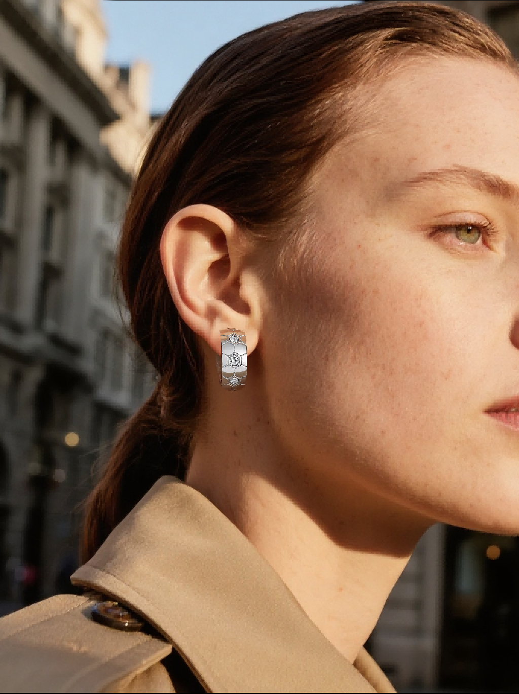 Own Your Bloom hexagon silver diamond earrings worn by woman in city street sunlight, elegant and contemporary style jewelry, New York.