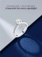 Own Your Bloom 14K large teardrop diamond ring artistic shot on blue and silver backdrop, elegant engagement design, San Francisco.