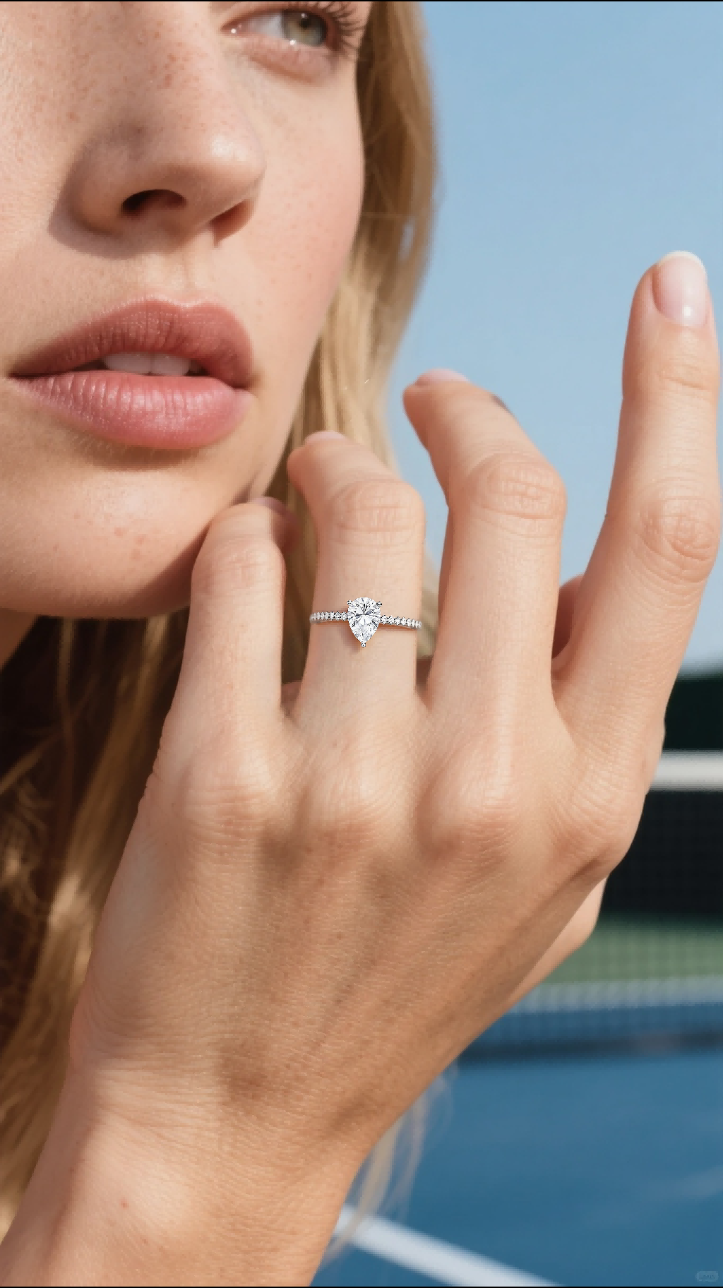 Own Your Bloom 14K large teardrop diamond ring worn by woman in elegant athletic look, modern luxury jewelry, San Diego.