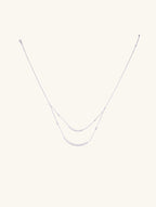 Own Your Bloom Layered Crystal Necklace front view featuring two elegant crystal strands with minimalist silver chains, New York.