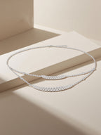 Own Your Bloom Double Layer Necklace in elegant beige setting, symbolizing contemporary luxury and timeless charm, Dallas.